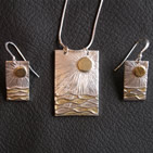 Pendant: rectangle with gold sun shining onto waves; matching earrings