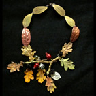 Necklace: apple leaves, oak twig with oak leaves in autumn colours, acorns, red rosehips and blackberries
