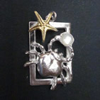 Brooch: silver rectangular frame, crab holding pearl, gold starfish above