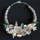 Lampwork necklace adorned with lampwork shells with pearl bead centres
