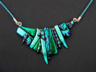Dichroic glass necklace adornment: a mosaic of tiny pieces of different patterns and shades of green