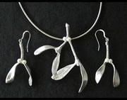 Necklace with sprig of mistletoe; matching earrings