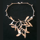 Mistletoe necklace with sprigs of mistletoe and small white beads for berries