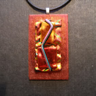 Abstract rectangular pendant of dichroic glass in shades of bitter orange