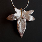Pendant: silver ivy leaf with tendrils and berry