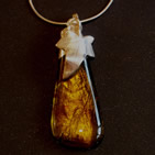 Amber dichroic glass teardrop pendant with silver leaf setting