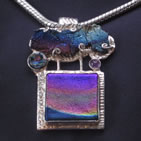 Pendant: combination of dichroic glass shapes in silver settings