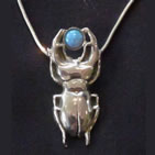 Pendant: silver scarab beetle with small circular turquoise stone