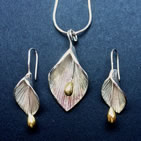 Shell/bell pendant with matching earrings