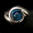 Silver ring with circular blue dichroic glass inset