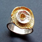 Wide ring with gold flower